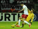 22 Marzec 2013; Robert Lewandowski, Polska i Denys Harmasz, Ukraina. Mecz Eliminacji Mistrzostw Świata 2014 w Brazylii - Polska v Ukraina. Stadion Narodowy, Warszawa, Polska. Fot. Tomasz Żuber / GrFoto.org