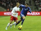 26 Marzec 2013; Kamil Grosicki, Polska i Alex Gasperoni, San Marino. Mecz eliminacji Mistrzostw Świata 2014 - Polska v San Marino. Stadion Narodowy, Warszawa, Polska. Fot. Tomasz Żuber / GrFoto.org *** Local Caption *** 26 March 2013; Kamil Grosicki, Poland and Alex Gasperoni, San Marino. 2014 FIFA World Cup qualification – UEFA Group H - Poland v San Marino. Warsaw National Stadium, Poland. Picture credit: Tomasz Zuber / GrFoto.org