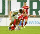 15 Wrzesień 2012; Grzegorz Rasiak, Lechia Gdańsk i Paweł Oleksy, Piast Gliwice. Czwarta kolejka T-Mobile Ekstraklasa 2012/2013 - Lechia Gdańsk v Piast Gliwice. PGE Arena Gdańsk. Fot. Tomasz Żuber / GrFoto.org *** Local Caption *** 15 September 2012; Grzegorz Rasiak, Lechia Gdańsk and Pawel Oleksy, Piast Gliwice. T-Mobile Ekstraklasa 2012/2013, Round 4 - Lechia Gdańsk v Piast Gliwice. PGE Arena Gdańsk. Picture credit: Tomasz Żuber / GrFoto.org