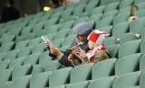 9 Czerwiec 2011; Kibice przeglądający program meczu. Międzynarodowy mecz towarzyski w ramach przygotowań do Euro 2012 - Polska v Francja. Stadion Legii Warszawa. Fot. Tomasz Żuber / GrFoto.org *** Local Caption *** 9 June 2011; Supporters during the game.
International friendly match - Poland v France. Stadium Legii Warszawa. Picture credit: Tomasz Żuber / GrFoto.org