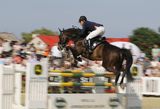 12 Czerwiec 2011; Bockmanns Lazio, w siodle Cassio Rivetti, Ukraina, podczas międzynarodowych zawodów jeździeckich w skokach przez przeszkody. Grand Prix Sopotu o Puchar NDI S.A. i nagrodę Prezydenta RP Bronisława Komorowskiego. Konkurs kwalifikacyjny do Olimpiady 2012 i ME seniorów 2011. Hipodrom, Sopot. Fot. Tomasz Żuber / GrFoto.org