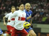 26 Marzec 2013; Robert Lewandowski, Polska i Fabio Bollini, San Marino. Mecz eliminacji Mistrzostw Świata 2014 - Polska v San Marino. Stadion Narodowy, Warszawa, Polska. Fot. Tomasz Żuber / GrFoto.org *** Local Caption *** 26 March 2013; Robert Lewandowski, Poland and Fabio Bollini, San Marino. 2014 FIFA World Cup qualification – UEFA Group H - Poland v San Marino. Warsaw National Stadium, Poland. Picture credit: Tomasz Zuber / GrFoto.org